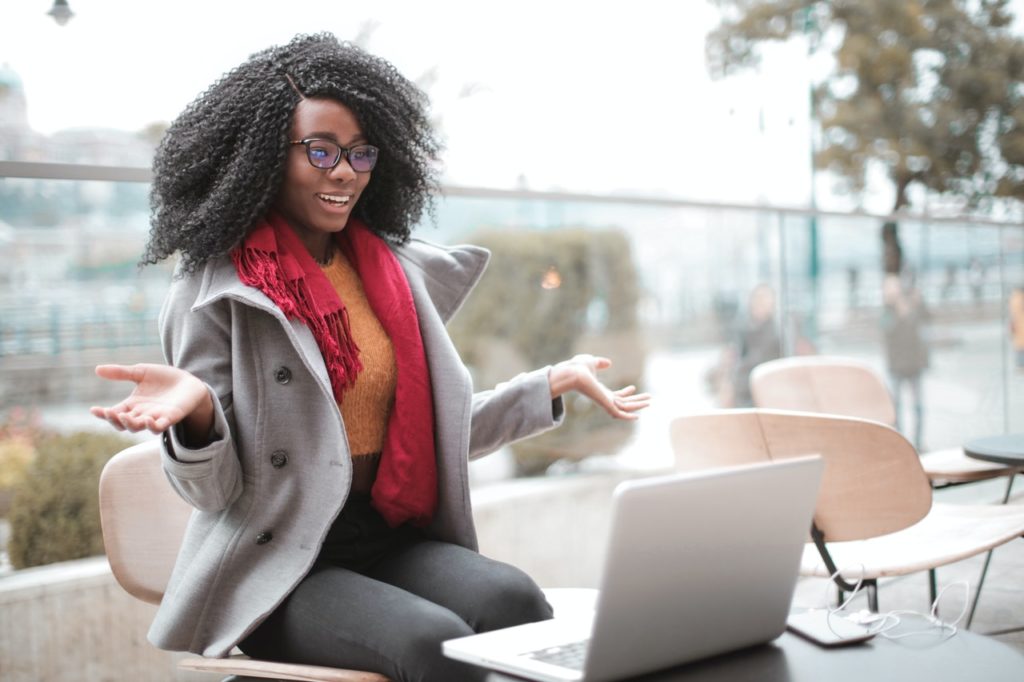 Woman talking on laptop